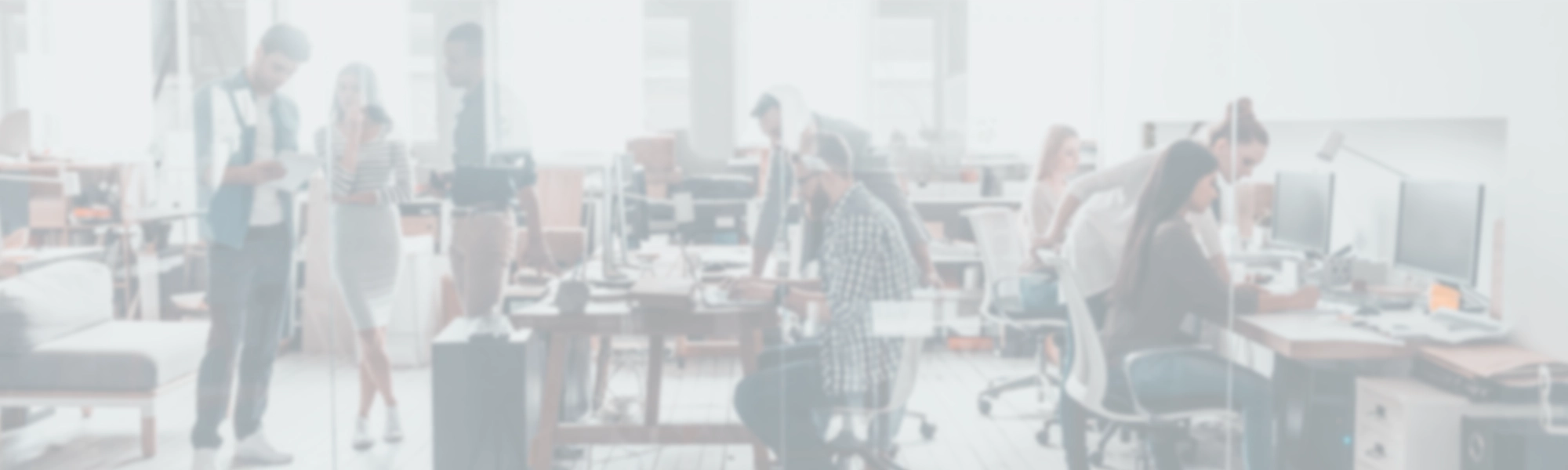 The Upper Echelon Products office, with people working at shared desks